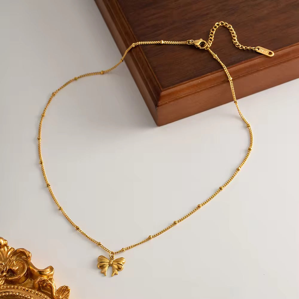 Tiny Golden Bow Necklace